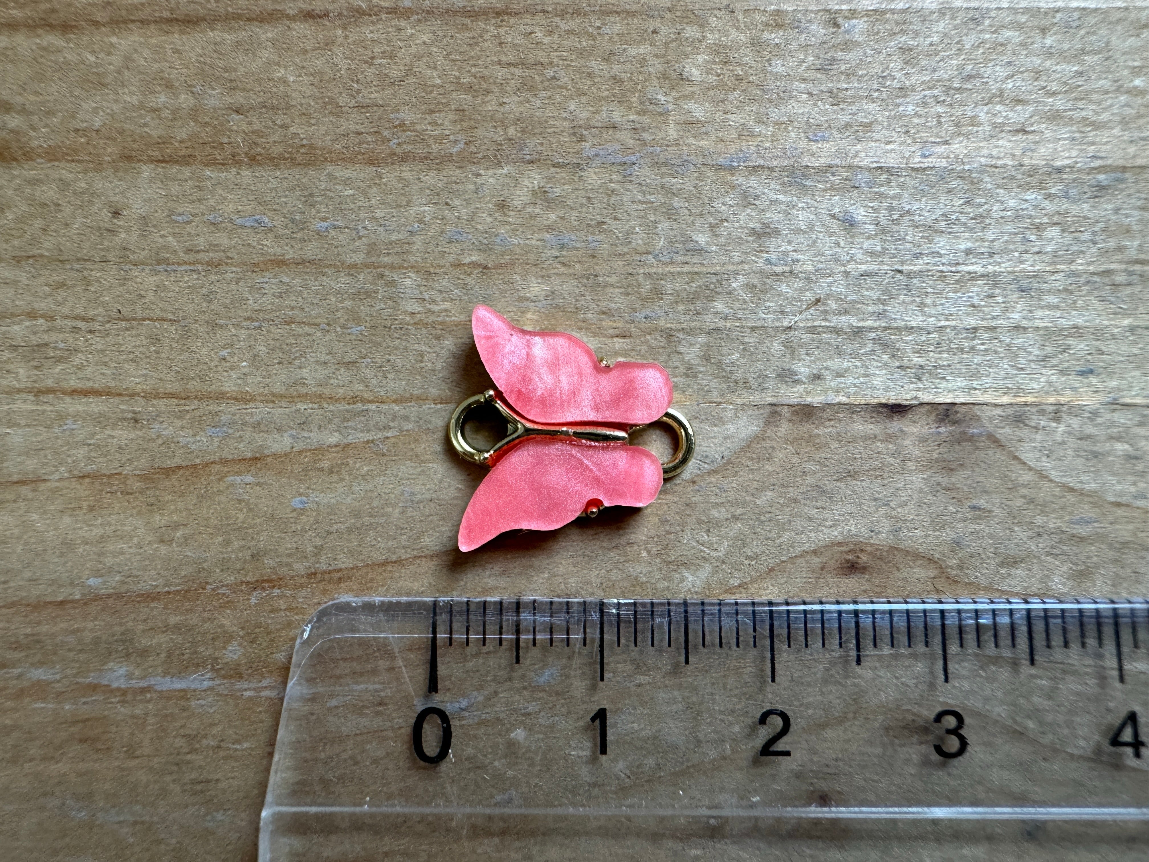 Zwischenteil Resin "Schmetterling", Farbe coral red, gold