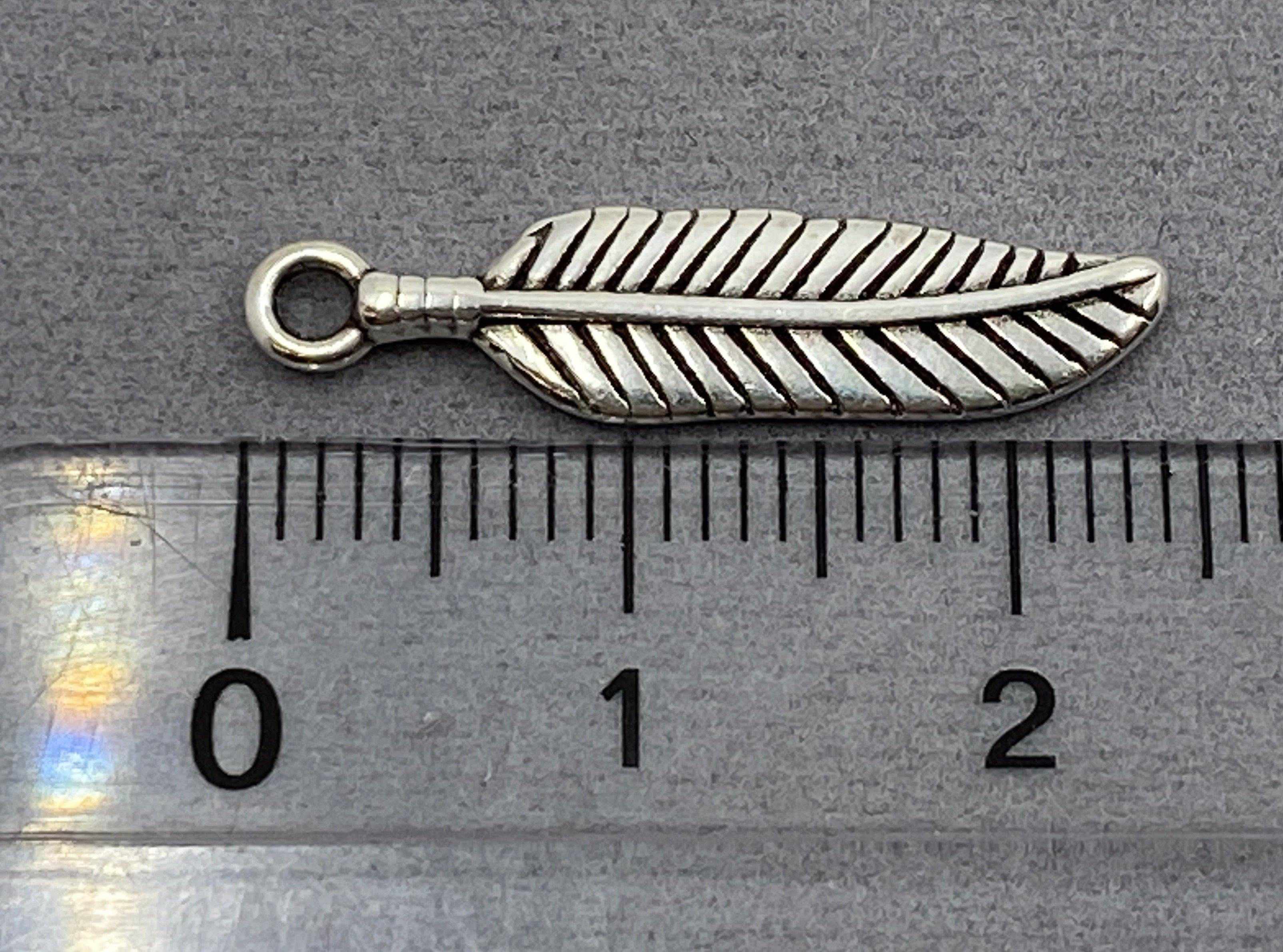 Anhänger Metall Feder 24 mm, Farbe altsilber - bead&more