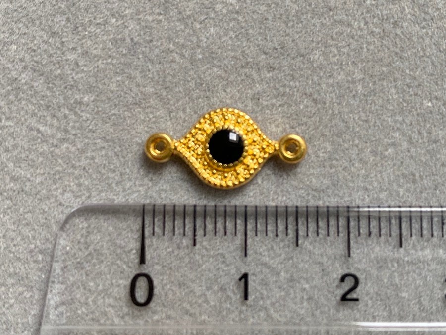Partie intermédiaire en métal "Eye", couleur noir - or