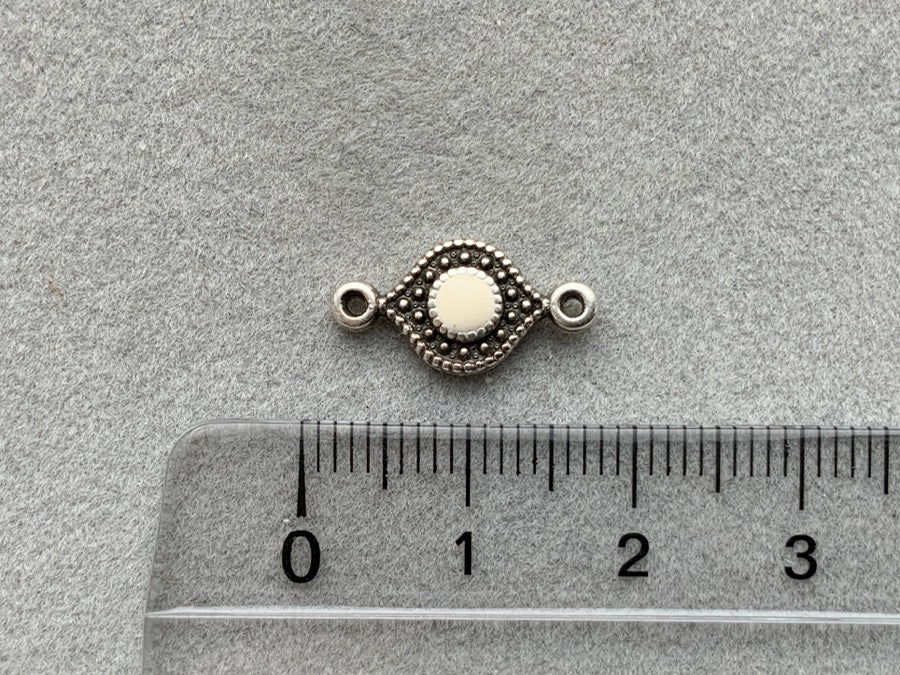 Parte intermedia "Eye" in metallo, colore bianco panna - argento antico