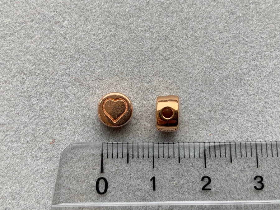 Perle en métal "coeur rond", or rose