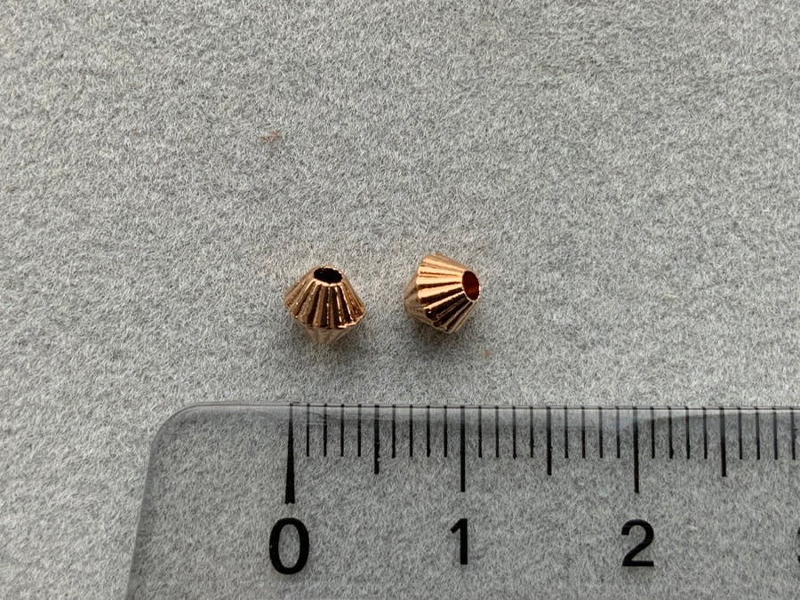 Perle en métal "conique", or rose