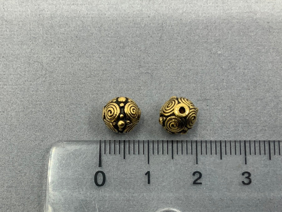 Perlina metallica "Spirali", ottone