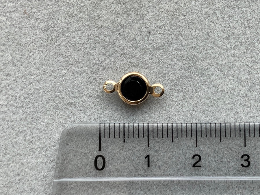 Parte intermedia in metallo "cristallo tondo", colore nero opaco - oro
